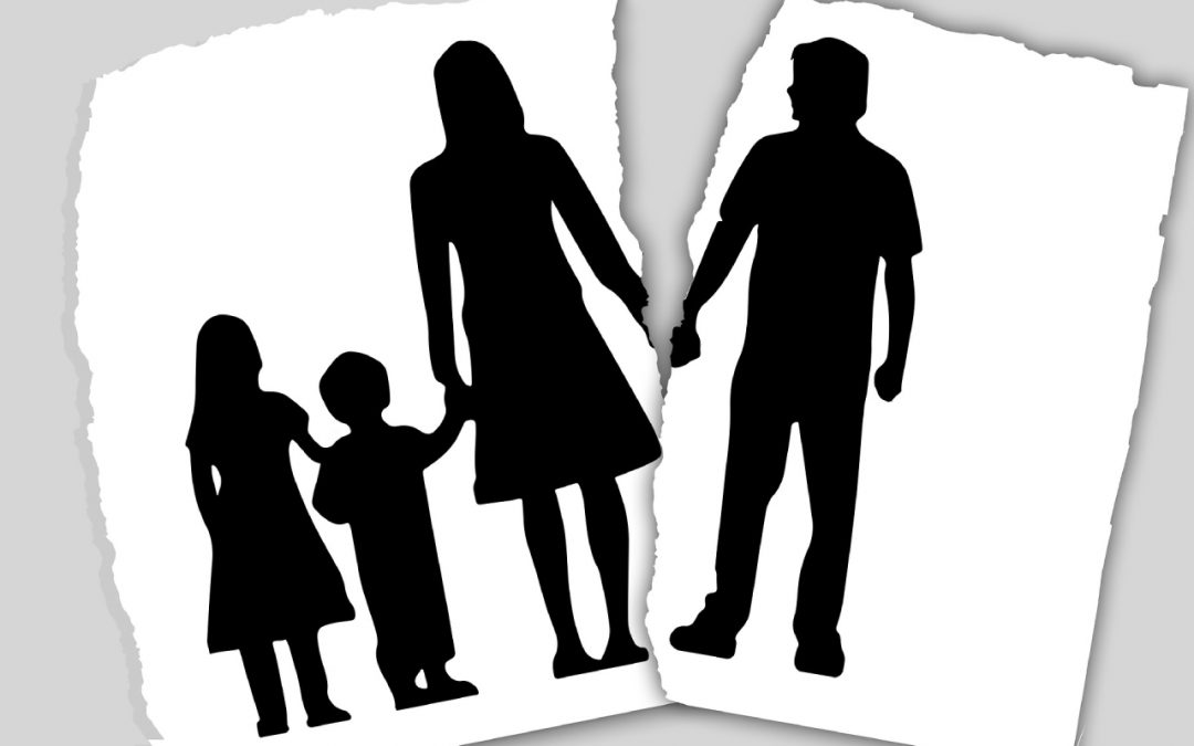 Silhouettes of a family holding hands, separated by a torn paper effect, illustrating the concept of family separation or divorce. If you're facing such challenges, consulting a Chicago divorce attorney can offer guidance and support through this difficult time.